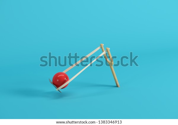 red-ball-slingshot-on-blue-600w-1383346913.jpg